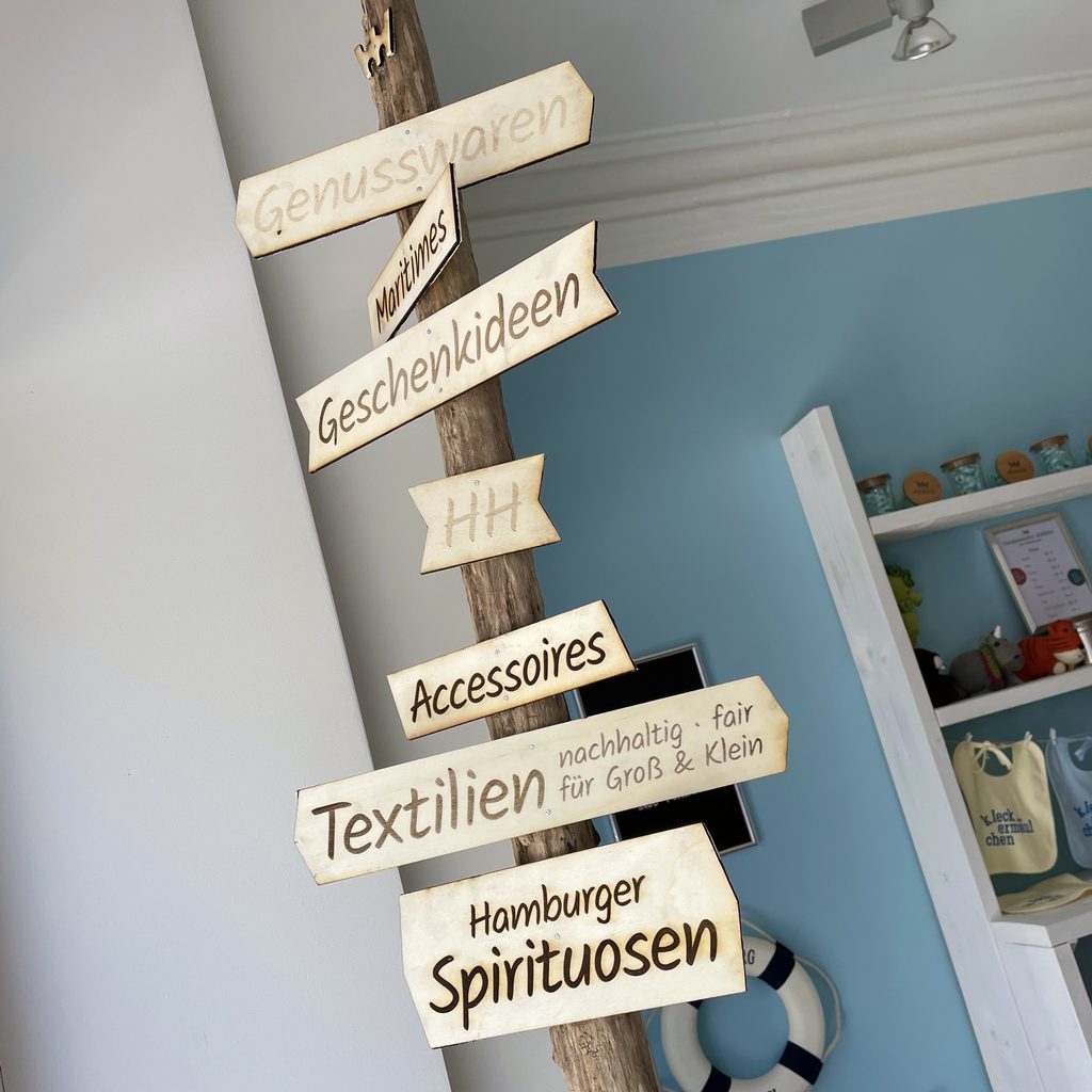 Souvenir shop in Hamburg Altona – wooden signs inside the store elbstolz